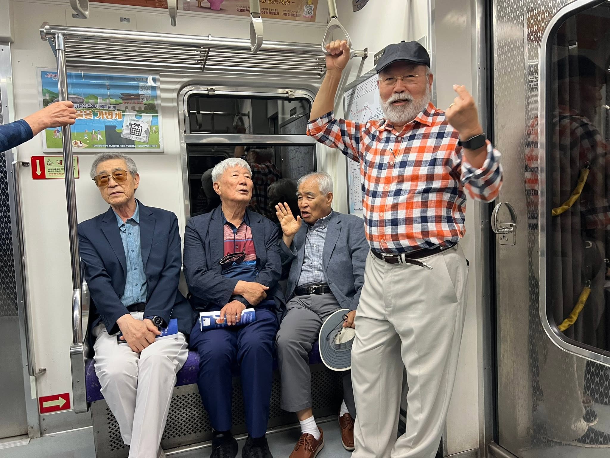 May be an image of one or more people, turnstile and train
