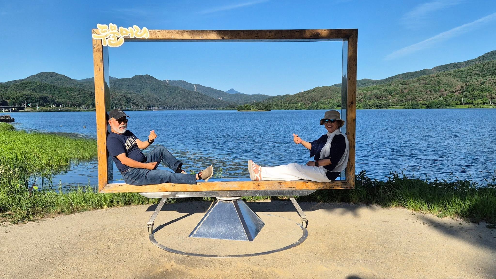 May be an image of lake and text