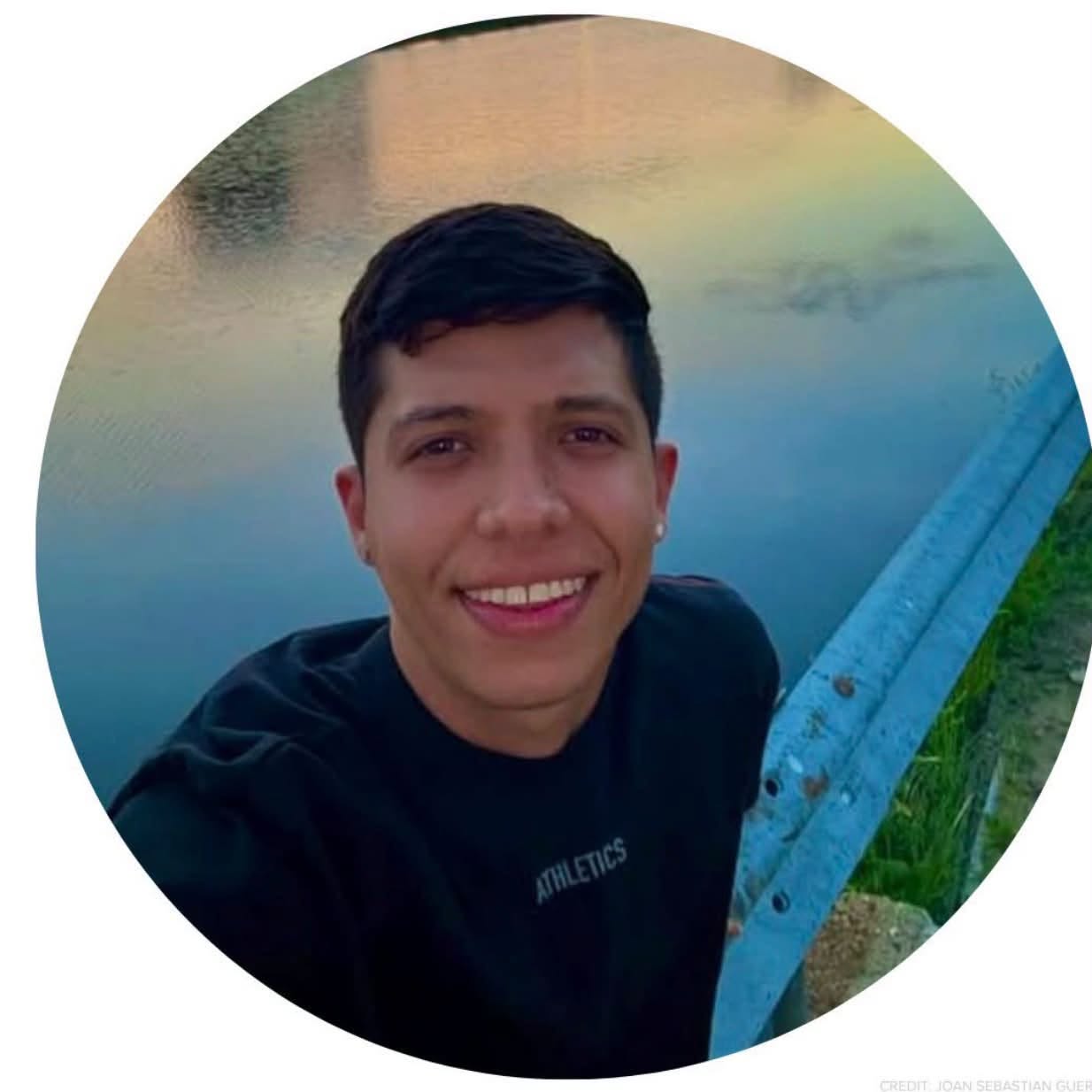 May be an image of smiling and lake